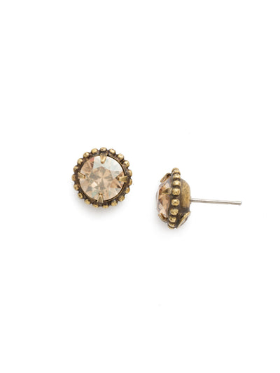 Simplicity Stud Earrings - EBY38AGDCH - <p>A timeless classic, the Simplicity Stud Earrings feature round cut crystals in a variety of colors; accented with a halo of metal beaded detail. Need help picking a stud? <a href="https://www.sorrelli.com/blogs/sisterhood/round-stud-earrings-101-a-rundown-of-sizes-styles-and-sparkle">Check out our size guide!</a> From Sorrelli's Dark Champagne collection in our Antique Gold-tone finish.</p>