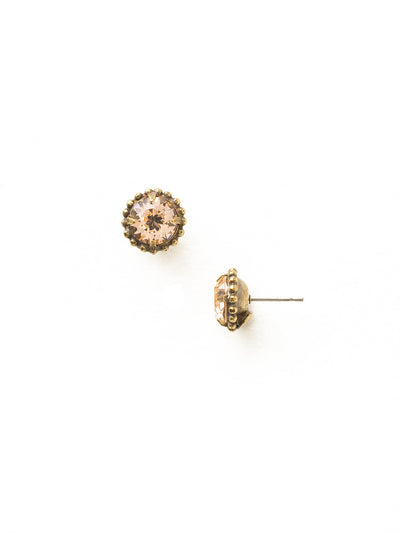 Simplicity Stud Earrings - EBY38AGLPE - <p>A timeless classic, the Simplicity Stud Earrings feature round cut crystals in a variety of colors; accented with a halo of metal beaded detail. Need help picking a stud? <a href="https://www.sorrelli.com/blogs/sisterhood/round-stud-earrings-101-a-rundown-of-sizes-styles-and-sparkle">Check out our size guide!</a> From Sorrelli's Light Peach collection in our Antique Gold-tone finish.</p>