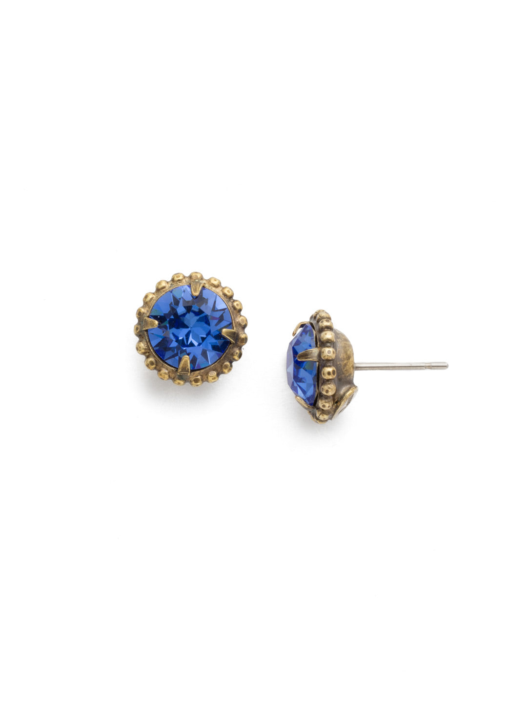 Simplicity Stud Earrings - EBY38AGSAP - <p>A timeless classic, the Simplicity Stud Earrings feature round cut crystals in a variety of colors; accented with a halo of metal beaded detail. Need help picking a stud? <a href="https://www.sorrelli.com/blogs/sisterhood/round-stud-earrings-101-a-rundown-of-sizes-styles-and-sparkle">Check out our size guide!</a> From Sorrelli's Sapphire collection in our Antique Gold-tone finish.</p>