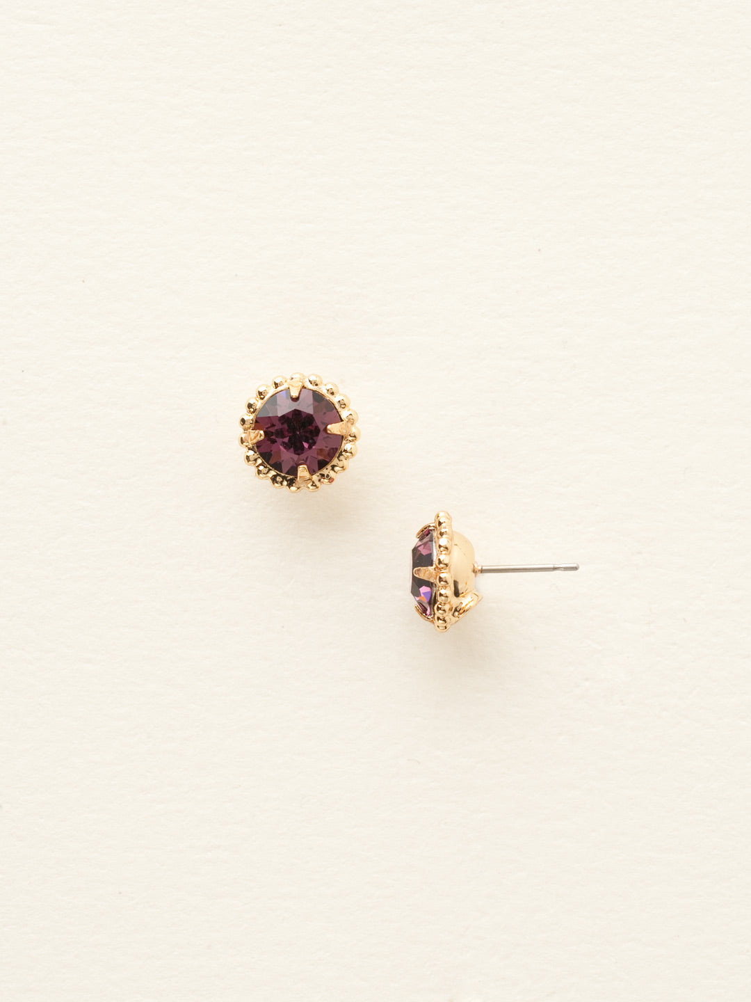 Simplicity Stud Earrings - EBY38BGAM - <p>A timeless classic, the Simplicity Stud Earrings feature round cut crystals in a variety of colors; accented with a halo of metal beaded detail. Need help picking a stud? <a href="https://www.sorrelli.com/blogs/sisterhood/round-stud-earrings-101-a-rundown-of-sizes-styles-and-sparkle">Check out our size guide!</a> From Sorrelli's Amethyst collection in our Bright Gold-tone finish.</p>
