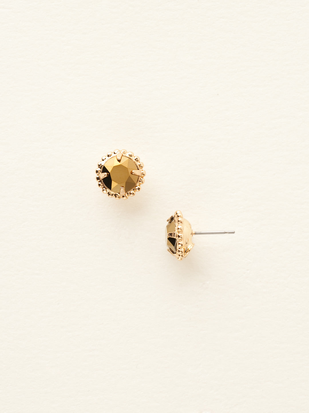 Simplicity Stud Earrings - EBY38BGDO - <p>A timeless classic, the Simplicity Stud Earrings feature round cut crystals in a variety of colors; accented with a halo of metal beaded detail. Need help picking a stud? <a href="https://www.sorrelli.com/blogs/sisterhood/round-stud-earrings-101-a-rundown-of-sizes-styles-and-sparkle">Check out our size guide!</a> From Sorrelli's Dorado collection in our Bright Gold-tone finish.</p>