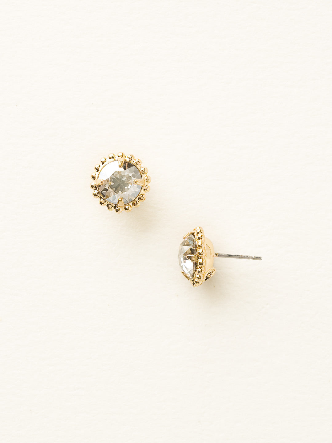 Simplicity Stud Earrings - EBY38BGSSH - <p>A timeless classic, the Simplicity Stud Earrings feature round cut crystals in a variety of colors; accented with a halo of metal beaded detail. Need help picking a stud? <a href="https://www.sorrelli.com/blogs/sisterhood/round-stud-earrings-101-a-rundown-of-sizes-styles-and-sparkle">Check out our size guide!</a> From Sorrelli's Silver Shade collection in our Bright Gold-tone finish.</p>