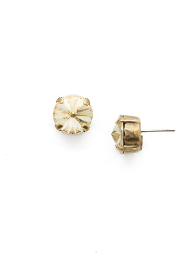 London Stud Earrings - ECM14AGCCH - <p>Everyone needs a great pair of studs. Add some classic sparkle to any occasion with these stud earrings. Need help picking a stud? <a href="https://www.sorrelli.com/blogs/sisterhood/round-stud-earrings-101-a-rundown-of-sizes-styles-and-sparkle">Check out our size guide!</a> From Sorrelli's Crystal Champagne collection in our Antique Gold-tone finish.</p>