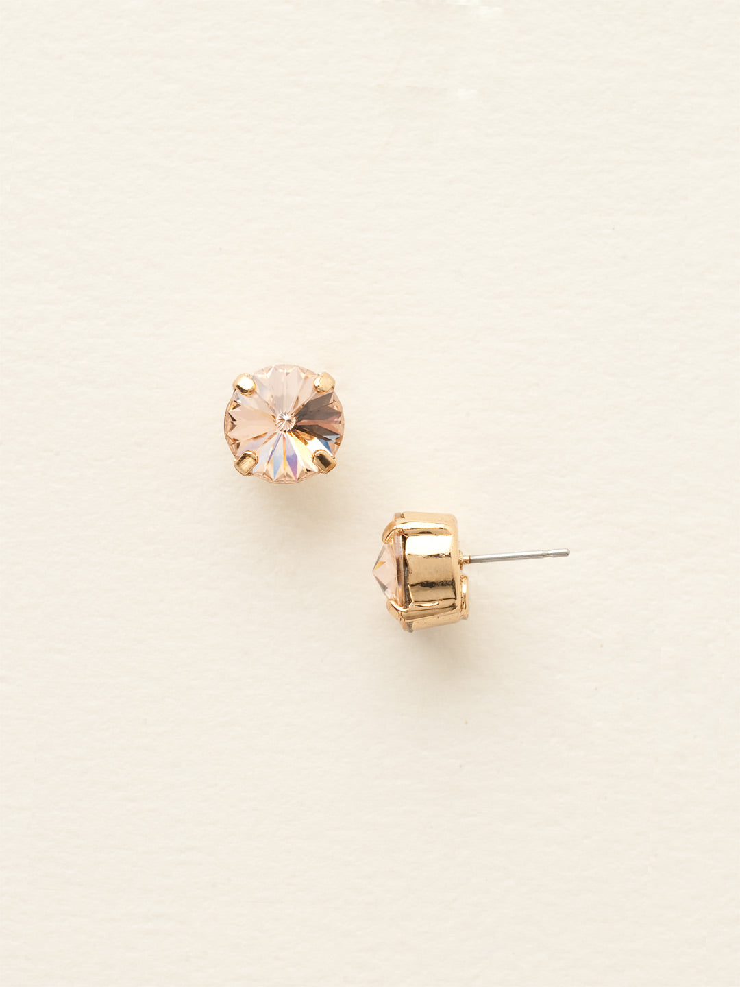 London Stud Earrings - ECM14BGLPE - <p>Everyone needs a great pair of studs. Add some classic sparkle to any occasion with these stud earrings. Need help picking a stud? <a href="https://www.sorrelli.com/blogs/sisterhood/round-stud-earrings-101-a-rundown-of-sizes-styles-and-sparkle">Check out our size guide!</a> From Sorrelli's Light Peach collection in our Bright Gold-tone finish.</p>