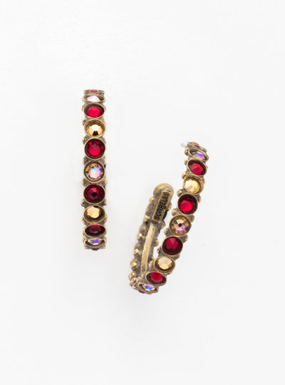 Heavenly Hoop Earrings - ECQ24AGGGA - <p>Gemstones cover the outside of these hoop earrings. Their simple style combined with the sparkle of the jewels makes it the perfect staple piece for your jewelry box. From Sorrelli's Go Garnet collection in our Antique Gold-tone finish.</p>