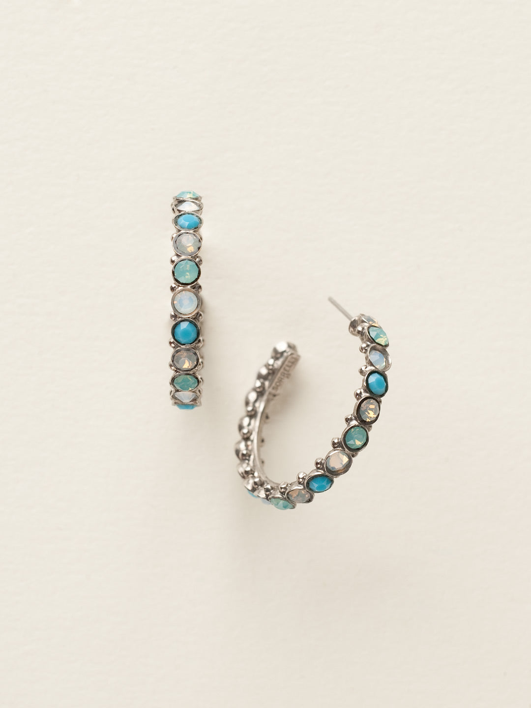 Heavenly Hoop Earrings - ECQ24ASAES - <p>Gemstones cover the outside of these hoop earrings. Their simple style combined with the sparkle of the jewels makes it the perfect staple piece for your jewelry box. From Sorrelli's Aegean Sea collection in our Antique Silver-tone finish.</p>