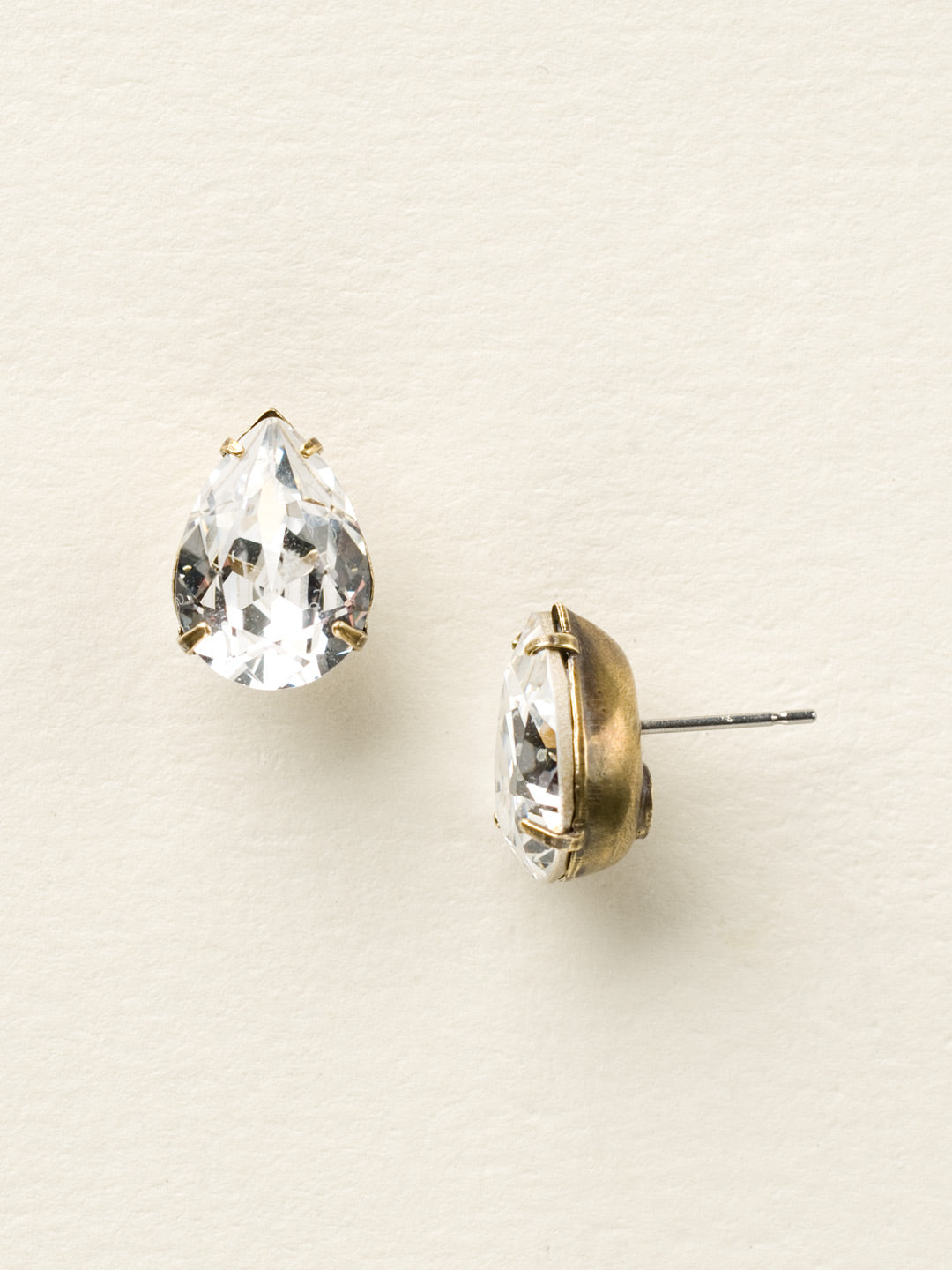 Ginnie Stud Earrings - ECR115AGCCL - <p>A beautiful basic stud. These classic single teardrop post earrings are perfect for any occasion, especially the everyday look. A timeless treasure that will sparkle season after season. From Sorrelli's Crystal Clear collection in our Antique Gold-tone finish.</p>