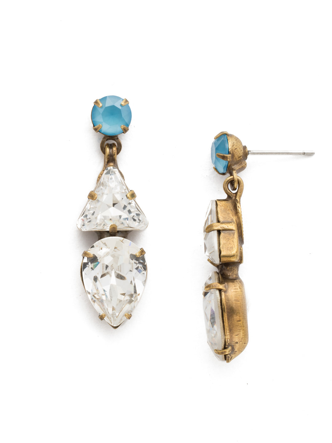 Trixie Dangle Earrings - EDM34AGSMR - <p>Elevate your style with the Trixie Dangle Earrings, showcasing a chic round crystal on a post, elegantly complemented by a dangling triangle and pear-cut crystal. From Sorrelli's Denim Blue collection in our Antique Gold-tone finish.</p>