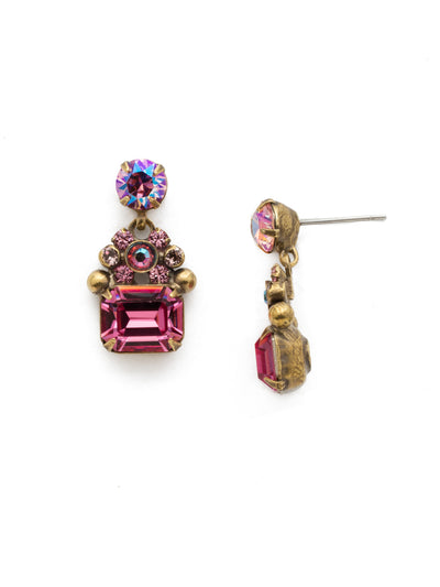Demure Dangle Earrings - EDU60AGPIN - <p>An embellished side-set emerald cut crystal hands from a radiant round cut stone in this demure dangle. From Sorrelli's Pink Passion collection in our Antique Gold-tone finish.</p>