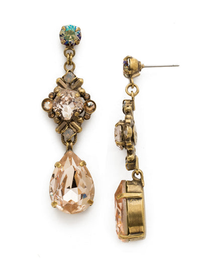 Acca Dangle Earrings - EDX26AGSTN - A three-layer dangling earring with a stud post, a pear shaped gem at the end, and an intricate design in the middle with a cushion cut antique stone in a crystal encrusted X design! From Sorrelli's Sandstone collection in our Antique Gold-tone finish.
