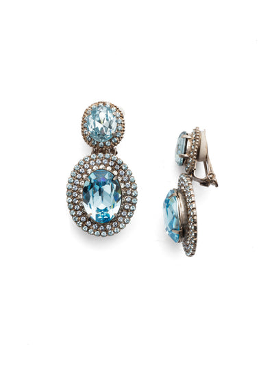 High Charm Dangle Earrings - ESP30CASAQU - <p>A statement clip-on earring is  the perfect piece for your collection. Two large circular crystals that will create a shimmering look. From Sorrelli's Aquamarine collection in our Antique Silver-tone finish.</p>
