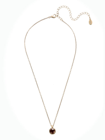 Simplicity Pendant Necklace - NBY38AGBUR - <p>Perfect for any day! The Simplicity Pendant Necklace features a round cut crystal with vintage edging. From Sorrelli's Burgundy collection in our Antique Gold-tone finish.</p>