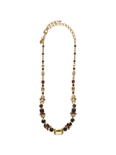 Center of Attention Tennis Necklace - NCF9AGTAP - This classic line necklace features a central emerald cut crystal flanked by a mix of crystals and cabochons in oval, square and round cuts. Classic style with all -around allure! From Sorrelli's Tapestry collection in our Antique Gold-tone finish.