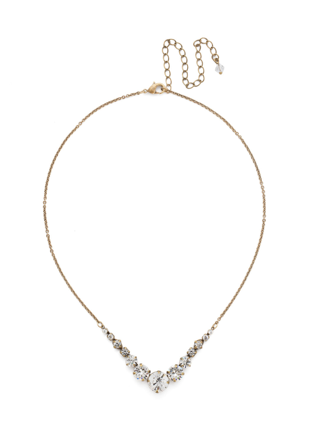 London Tennis Necklace - NCQ14AGCRY - <p>A long, simple chain paired with gorgeous round stones is exactly what every girl needs to dress things up. This round stone necklace is perfect for layering, or to just wear alone. Let the simple sparkle take over. From Sorrelli's Crystal collection in our Antique Gold-tone finish.</p>