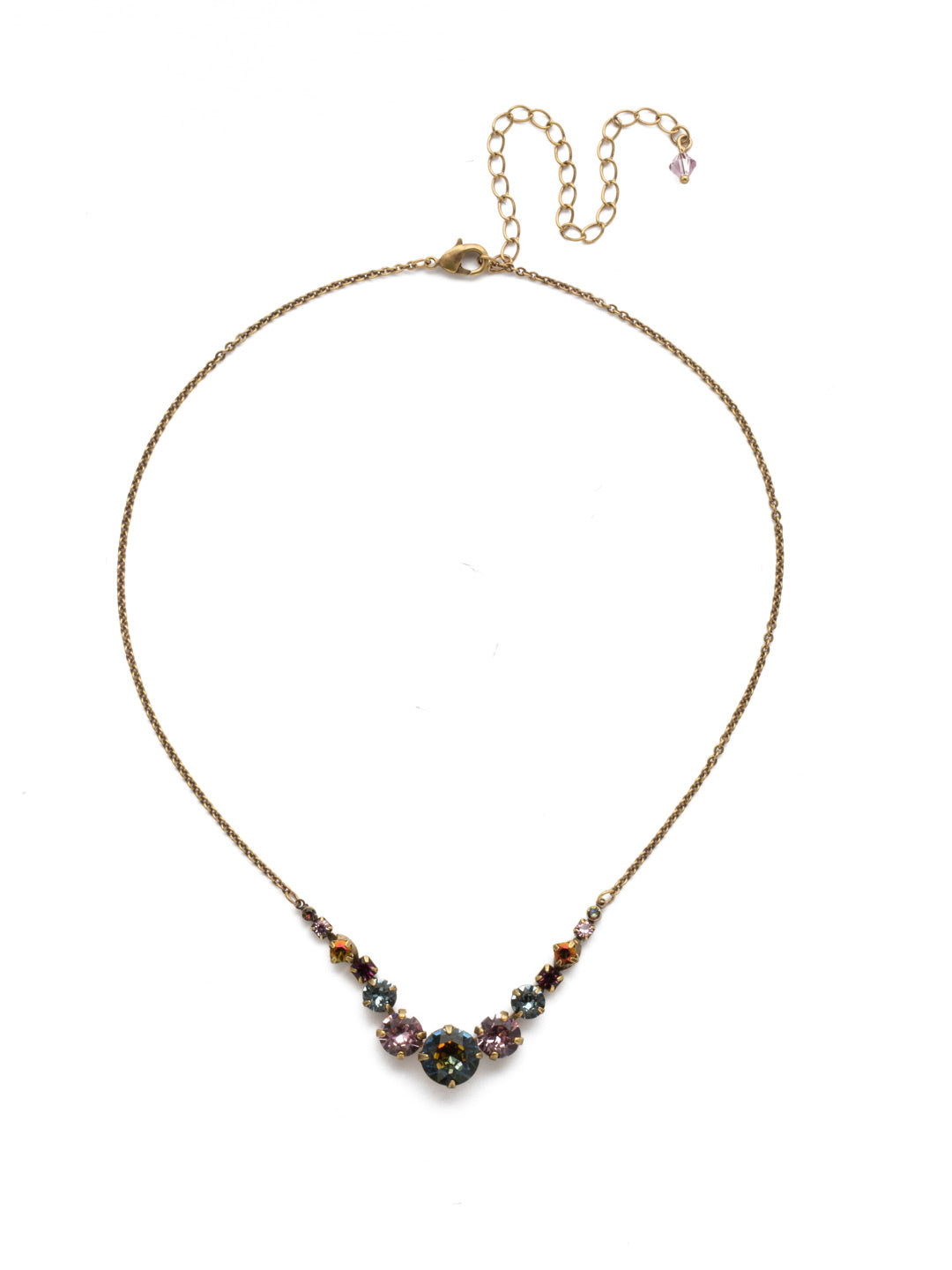 London Tennis Necklace - NCQ14AGROP - A long, simple chain paired with gorgeous round stones is exactly what every girl needs to dress things up. This round stone necklace is perfect for layering, or to just wear alone. Let the simple sparkle take over. From Sorrelli's Royal Plum collection in our Antique Gold-tone finish.