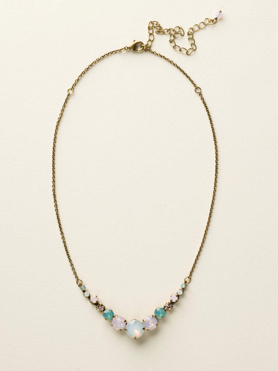London Tennis Necklace - NCQ14AGROW - A long, simple chain paired with gorgeous round stones is exactly what every girl needs to dress things up. This round stone necklace is perfect for layering, or to just wear alone. Let the simple sparkle take over. From Sorrelli's Rose Water collection in our Antique Gold-tone finish.