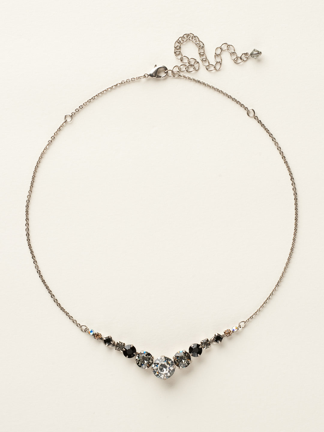 London Tennis Necklace - NCQ14ASEM - A long, simple chain paired with gorgeous round stones is exactly what every girl needs to dress things up. This round stone necklace is perfect for layering, or to just wear alone. Let the simple sparkle take over. From Sorrelli's Evening Moon collection in our Antique Silver-tone finish.