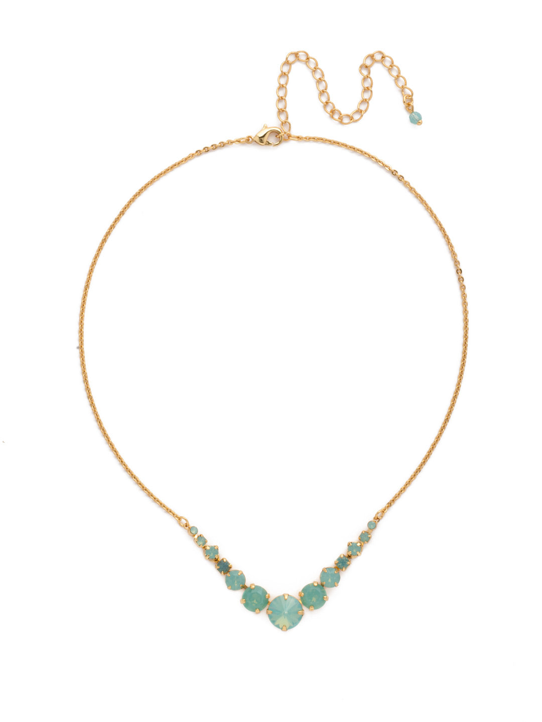London Tennis Necklace - NCQ14BGPAC - A long, simple chain paired with gorgeous round stones is exactly what every girl needs to dress things up. This round stone necklace is perfect for layering, or to just wear alone. Let the simple sparkle take over. From Sorrelli's Pacific Opal collection in our Bright Gold-tone finish.