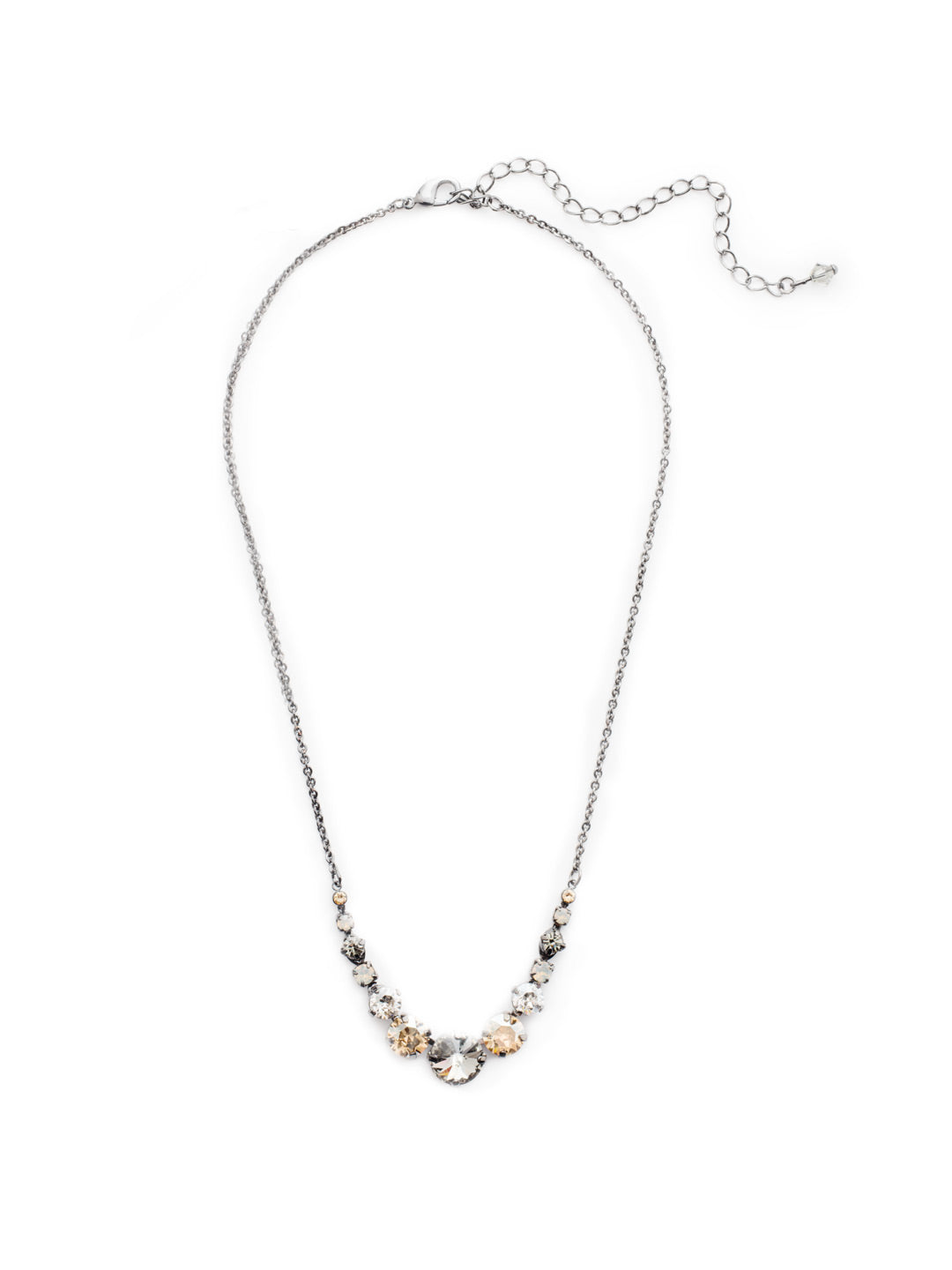 London Tennis Necklace - NCQ14GMGNS - A long, simple chain paired with gorgeous round stones is exactly what every girl needs to dress things up. This round stone necklace is perfect for layering, or to just wear alone. Let the simple sparkle take over. From Sorrelli's Golden Shadow collection in our Gun Metal finish.