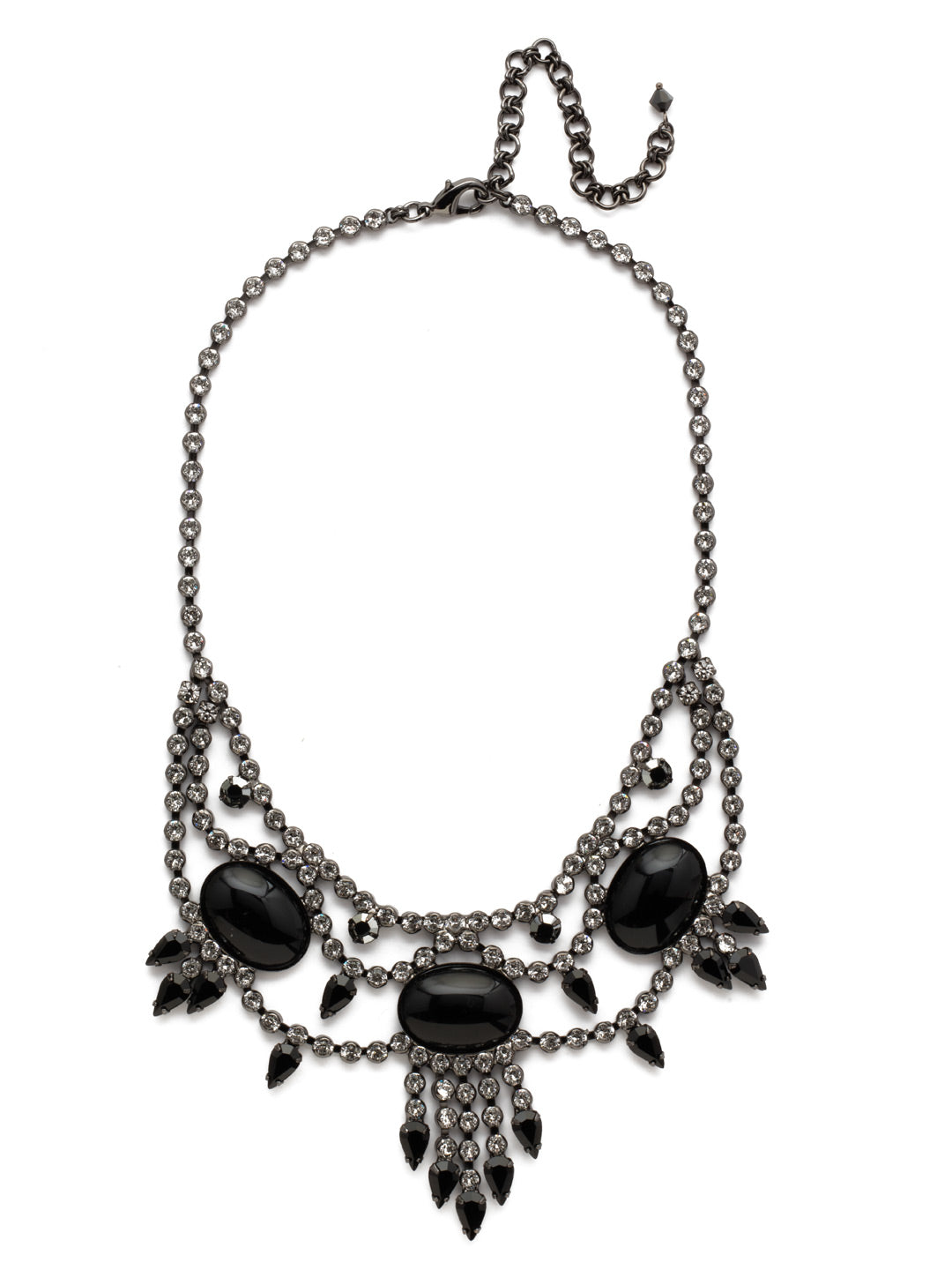 Living on the Fringe Statement Necklace - NCQ19GMMMO - Other pieces are envious of the uniqueness this necklace brings. Gems fringe out from the bottom, giving this statement an extra shot of pizzazz. The chain is covered in sparkle, leaving no room for anything but shine... and you, of course. From Sorrelli's Midnight Moon collection in our Gun Metal finish.