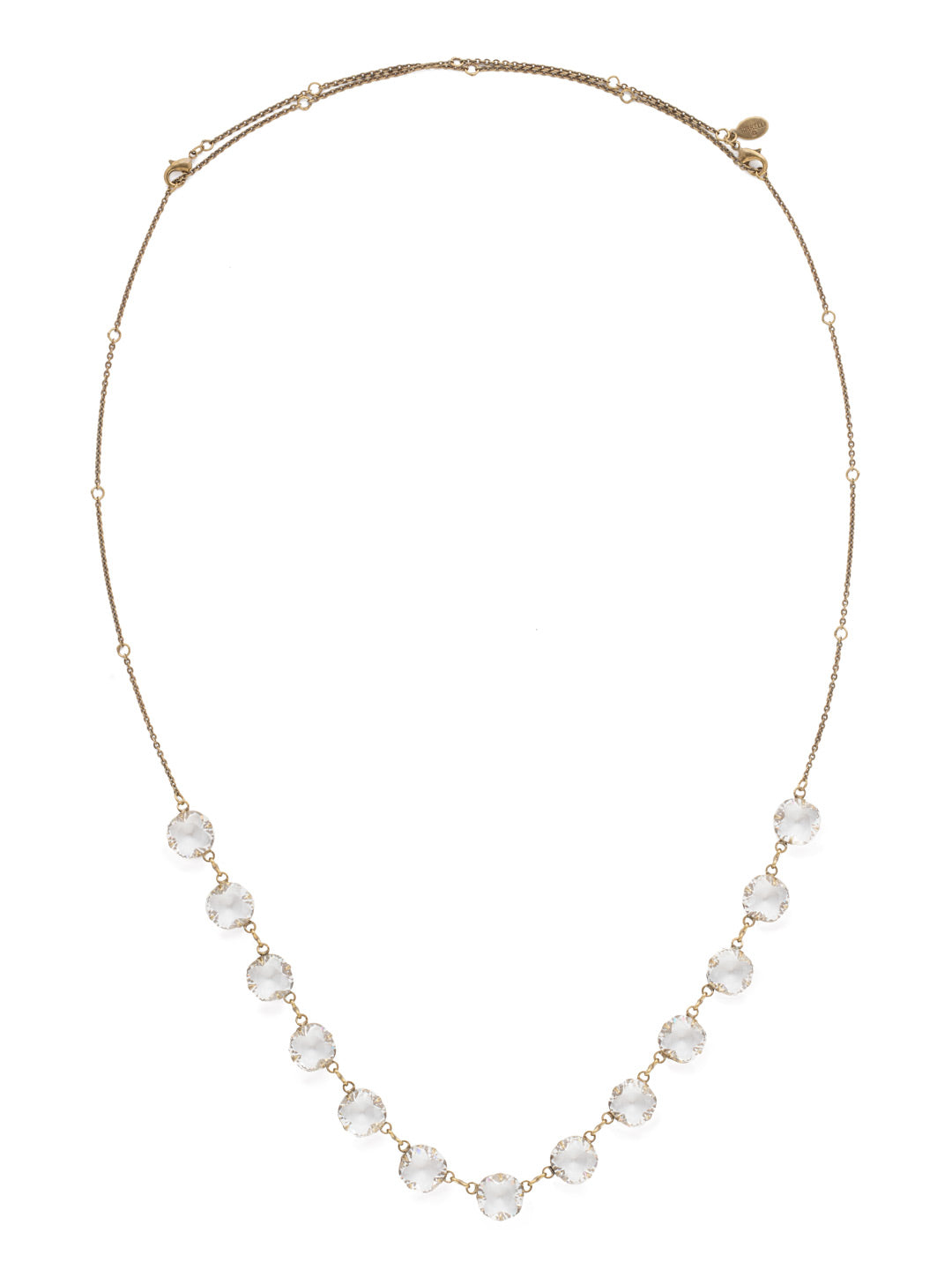 Crystal Rain Long Strand Necklace - NCR71AGCRY - <p>Dare to sparkle with this long strand necklace of evenly spaced cushion cut crystals. Rings placed throughout the chain allow this necklace to be worn as long or short as desired for maximum style! From Sorrelli's Crystal collection in our Antique Gold-tone finish.</p>