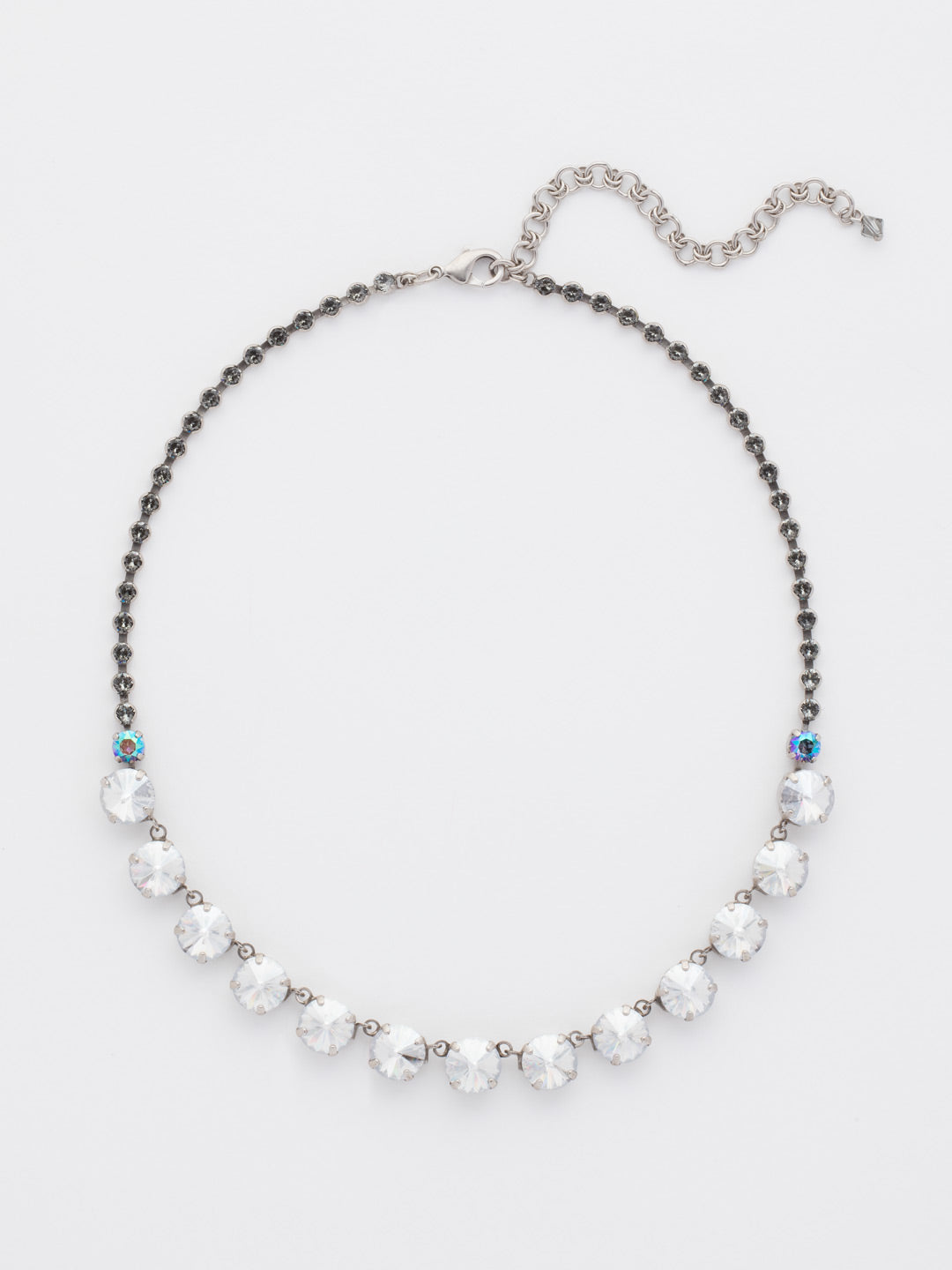 Repeating Rivoli Classic Line Necklace - NCU19ASCRO - A classic beauty! This line necklace boasts a little extra flare with its beautifully faceted rivoli crystals and decorative stone encrusted chain. You're set to sparkle from every angle.