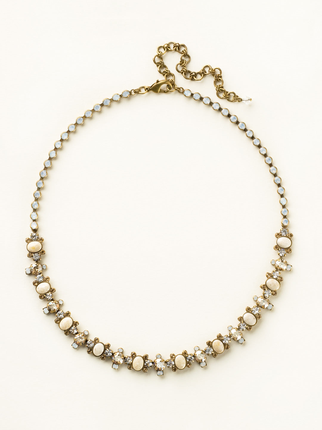 Semi-Precious Oval and Crystal Cluster Line Necklace - NDA8AGRIV - Clusters of crystals alternate between semi-precious oval stones in this classic line necklace. Rhinestone chain completes this design for all around sparkle!Due to the nature of natural, semi-precious stones, variations in color and pattern may occur. These variations make each Sorrelli piece one-of-a-kind!