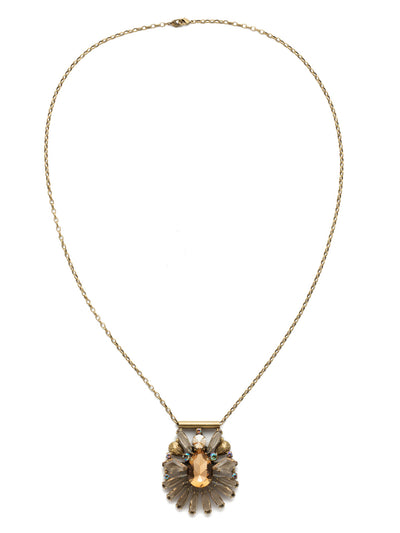 Radiant Gems Statement Pendant - NDK25AGNT - <p>Clusters of assorted crystals radiate from a large, central pear-cut crystal. A perfect piece to wear with anything! This style also features a double lobster claw closure which allows for extreme length adjustment and easy layering with other necklaces. From Sorrelli's Neutral Territory collection in our Antique Gold-tone finish.</p>