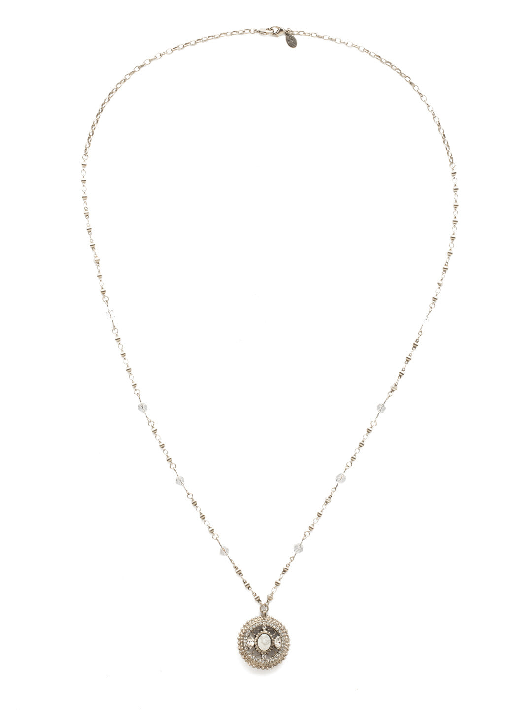 Majestic Medallion Pendant - NDK3ASCRY - An ornate gem-laden medallion is highlighted by a delicate textured chain in this must-have design. This style also features a double lobster claw closure which allows for extreme length adjustment and easy layering with other necklaces. From Sorrelli's Crystal collection in our Antique Silver-tone finish.