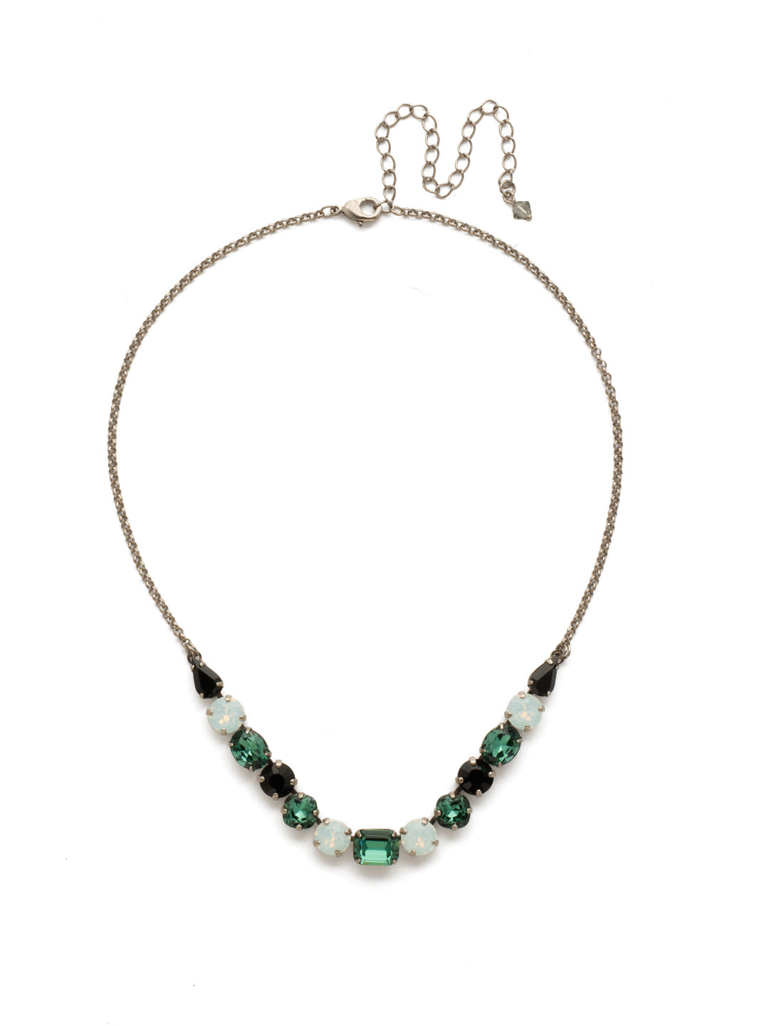 Tansy Half Line Tennis Necklace - NDQ14ASGDG - Oval, round, emerald, pear and cushion cut crystals are accented by a delicate chain for subtle sparkle that looks great layered or worn solo. From Sorrelli's Game Day Green collection in our Antique Silver-tone finish.