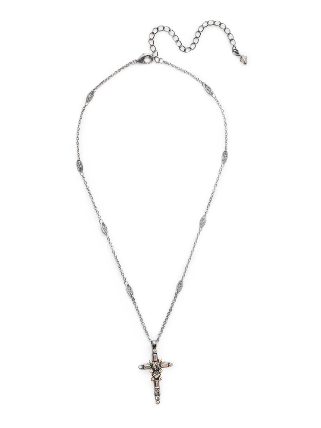 Dierdre Cross Pendant Necklace - NDQ54GMGNS - A truly divine pendant. This delicate cross necklace features multi-cut crystals in an antique inspired setting. This crystal cross necklace offers movement on the chain for ease of wear. From Sorrelli's Golden Shadow collection in our Gun Metal finish.