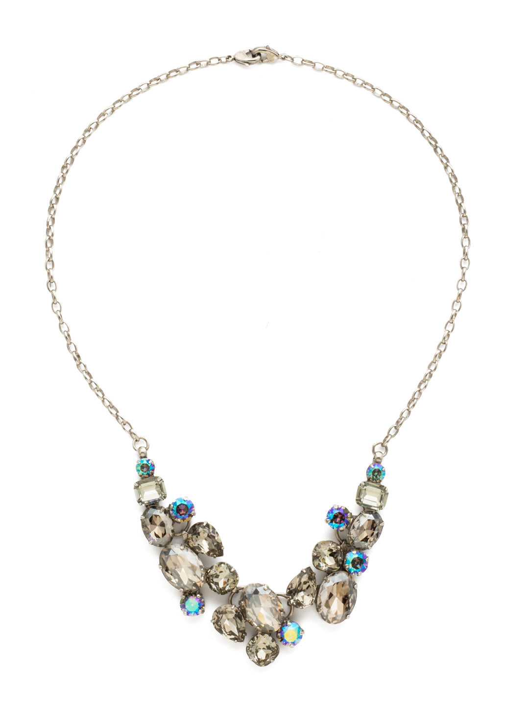 Forget-Me-Not Necklace Bib Necklace - NDQ6ASCRO - Captivating clusters of oval, pear, emerald, cushion and round cut crystals form a design that's fun and easy with sparkle for days! This style also features a double lobster claw closure which allows for extreme length adjustment and easy layering with other necklaces. From Sorrelli's Crystal Rock collection in our Antique Silver-tone finish.