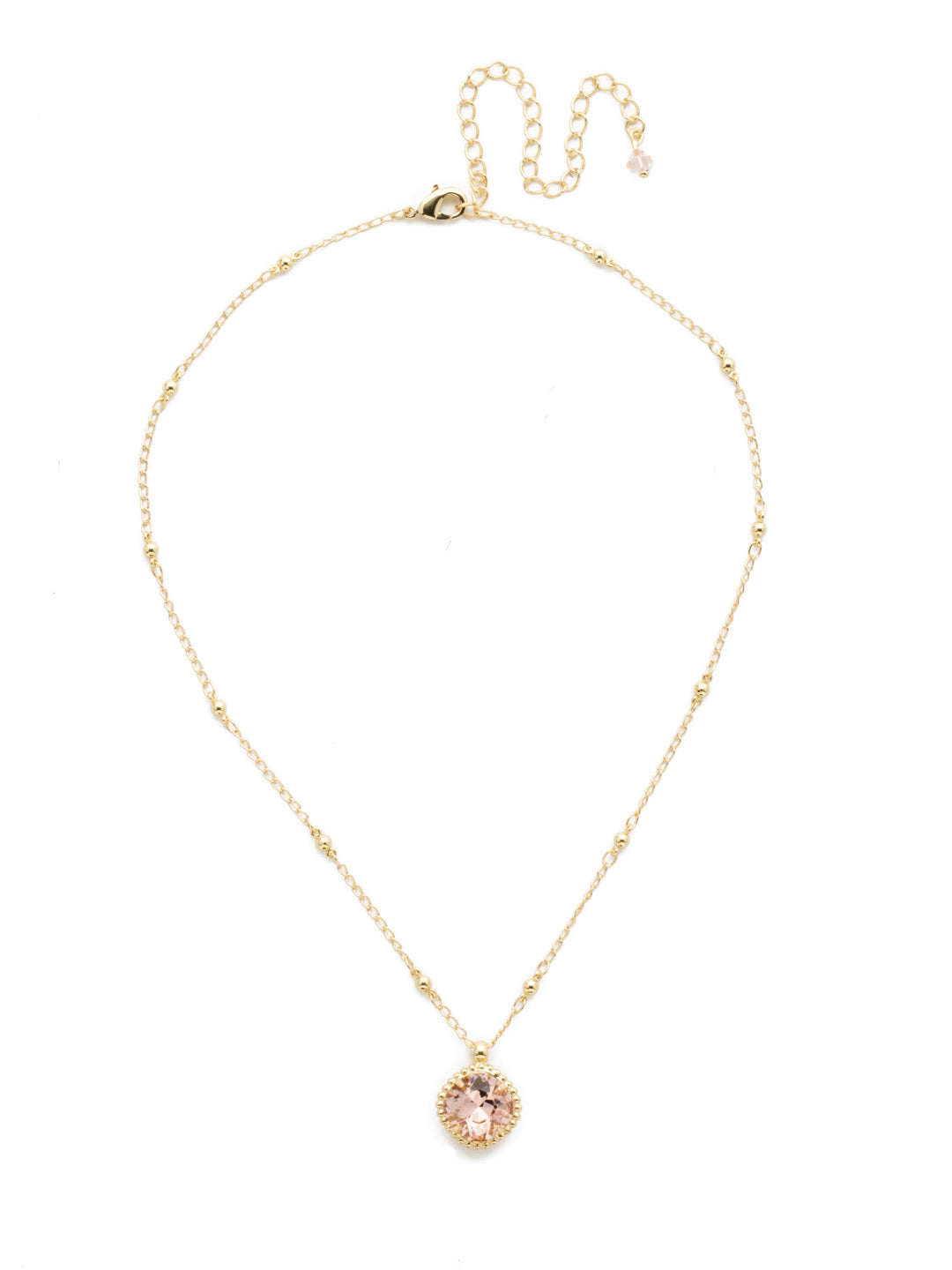 Cushion-Cut Pendant Necklace - NDS50BGVIN - <p>Elevate your jewelry collection with this artisanally handcrafted pendant necklace. The solitaire 12mm cushion cut crystal is surrounded by a beautifully scalloped edge, creating a unique and eye-catching design. The little ball details along the chain add a touch of character. This adjustable necklace features a 16 inch chain with a 4 inch extension, complete with a delicate charm, for a versatile fit. Whether you're looking for a special gift or a treat for yourself, this handcrafted necklace is a stylish and timeless choice. From Sorrelli's Vintage Rose collection in our Bright Gold-tone finish.</p>