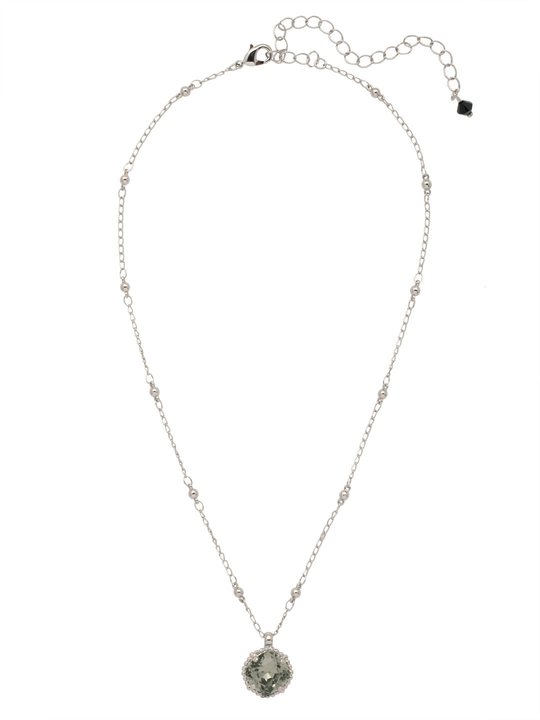 Cushion-Cut Pendant Necklace - NDS50PDSNI - <p>Elevate your jewelry collection with this artisanally handcrafted pendant necklace. The solitaire 12mm cushion cut crystal is surrounded by a beautifully scalloped edge, creating a unique and eye-catching design. The little ball details along the chain add a touch of character. This adjustable necklace features a 16 inch chain with a 4 inch extension, complete with a delicate charm, for a versatile fit. Whether you're looking for a special gift or a treat for yourself, this handcrafted necklace is a stylish and timeless choice. From Sorrelli's Starry Night collection in our Palladium finish.</p>