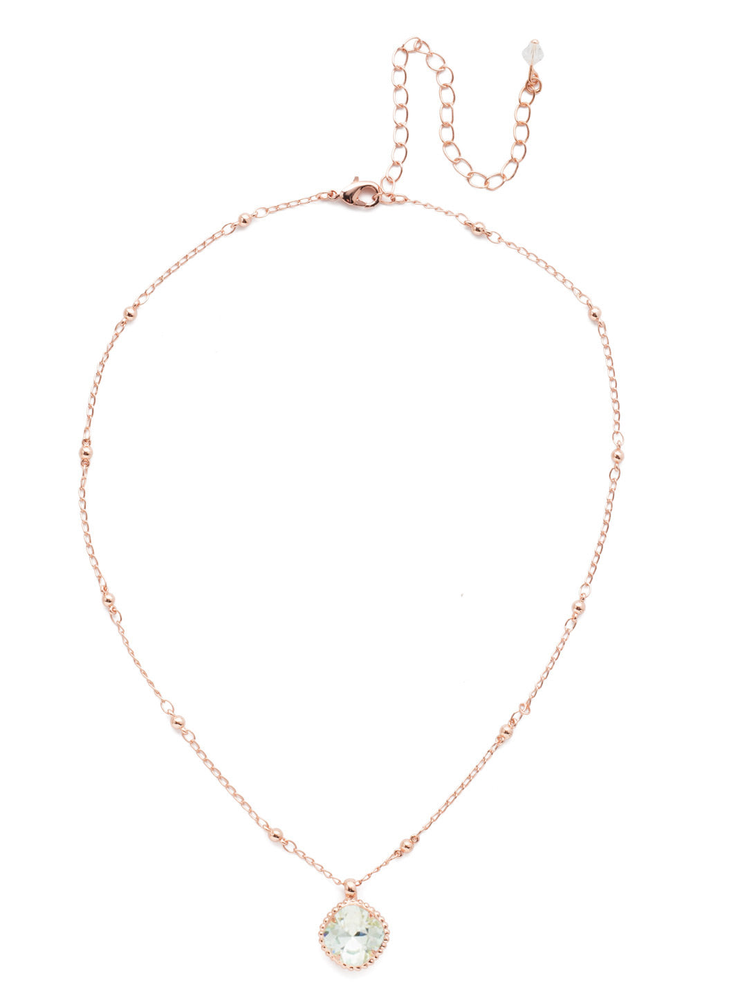 Cushion-Cut Pendant Necklace - NDS50RGLAQ - <p>Elevate your jewelry collection with this artisanally handcrafted pendant necklace. The solitaire 12mm cushion cut crystal is surrounded by a beautifully scalloped edge, creating a unique and eye-catching design. The little ball details along the chain add a touch of character. This adjustable necklace features a 16 inch chain with a 4 inch extension, complete with a delicate charm, for a versatile fit. Whether you're looking for a special gift or a treat for yourself, this handcrafted necklace is a stylish and timeless choice. From Sorrelli's Light Aqua collection in our Rose Gold-tone finish.</p>