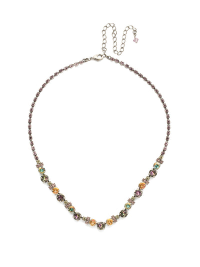 Limonium Necklace - NDU2ASLPA - This design shows an array of round, baguette, and square crystals set in a symmetrical pattern and accented with a rhinestone chain.