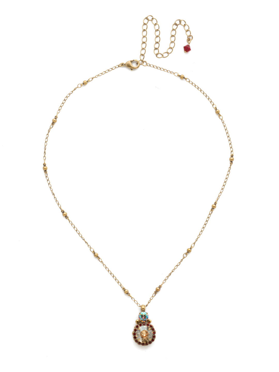 Embellished Rivoli Pendant Necklace - NDU44AGGGA - <p>A central round rivoli cut crystal is encircled with delicate rhinestones and embellished with petite circular stones. From Sorrelli's Go Garnet collection in our Antique Gold-tone finish.</p>