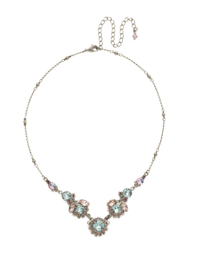 California Poppy Statement Necklace - NDU9ASLPA - <p>Elegance abounds with this assortment of round and navette crystal clusters adorned with metal ball details on a decorative chain. From Sorrelli's Lilac Pastel collection in our Antique Silver-tone finish.</p>