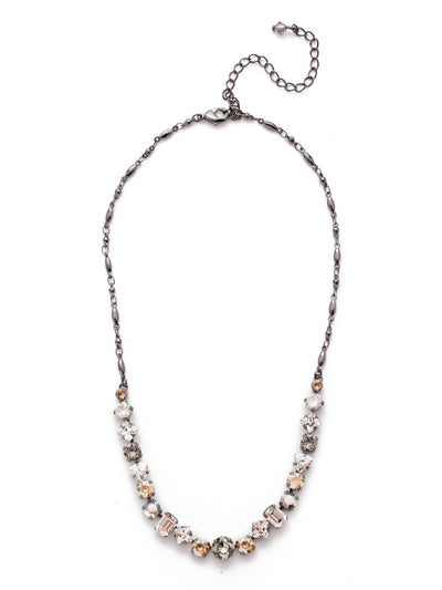 Papaver Tennis Necklace - NDX14GMGNS - This classic half line crystal necklace features an assortment of geometric shapes finished with a delicate metal chain. From Sorrelli's Golden Shadow collection in our Gun Metal finish.