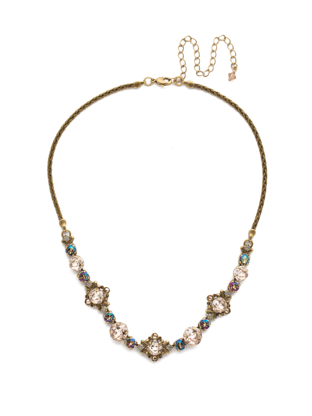 Stonecrop Tennis Necklace - NDX4AGSTN - A cushion cut stone in a detailed metal setting alternates with single round and cushion cut crystals in this dazzling half line necklace. From Sorrelli's Sandstone collection in our Antique Gold-tone finish.