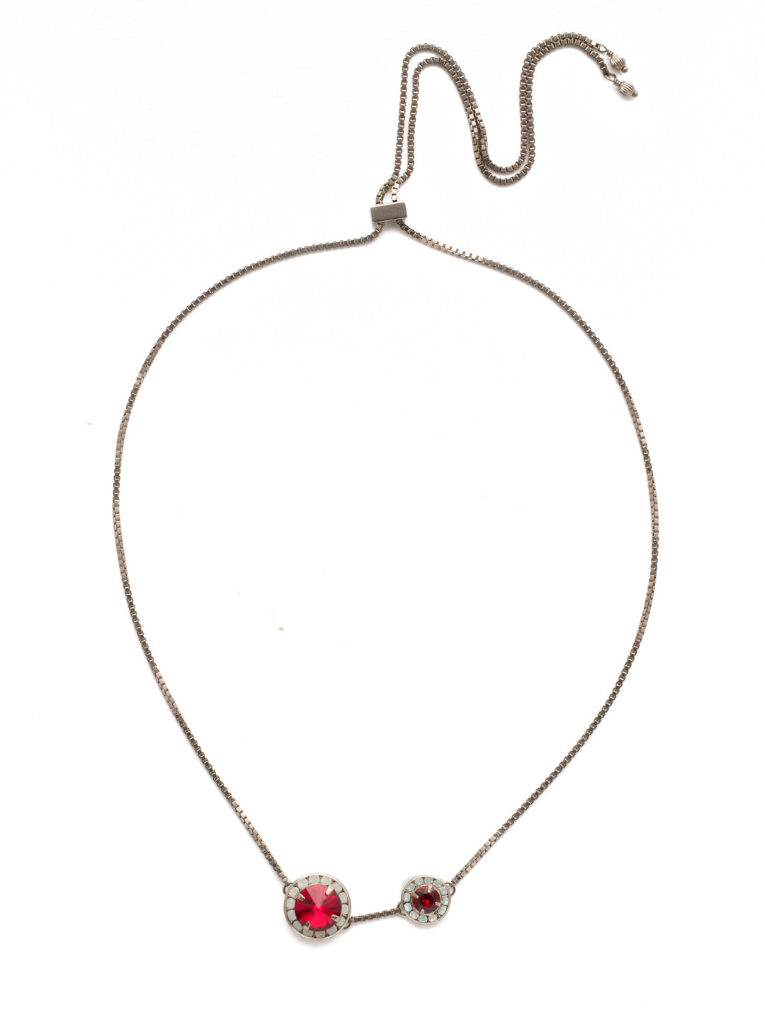 Dua Adjustable Pendant Necklace - NEB25ASCP - Two brilliant crystals bordered by smaller round crystals make up this simplistic yet glamorous choker, which can be adjusted to fit all sizes. Layer this necklace with others of varying lengths and shapes. From Sorrelli's Crimson Pride collection in our Antique Silver-tone finish.