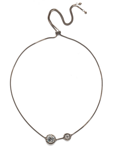 Dua Adjustable Pendant Necklace - NEB25ASCRY - <p>Two brilliant crystals bordered by smaller round crystals make up this simplistic yet glamorous choker, which can be adjusted to fit all sizes. Layer this necklace with others of varying lengths and shapes. From Sorrelli's Crystal collection in our Antique Silver-tone finish.</p>