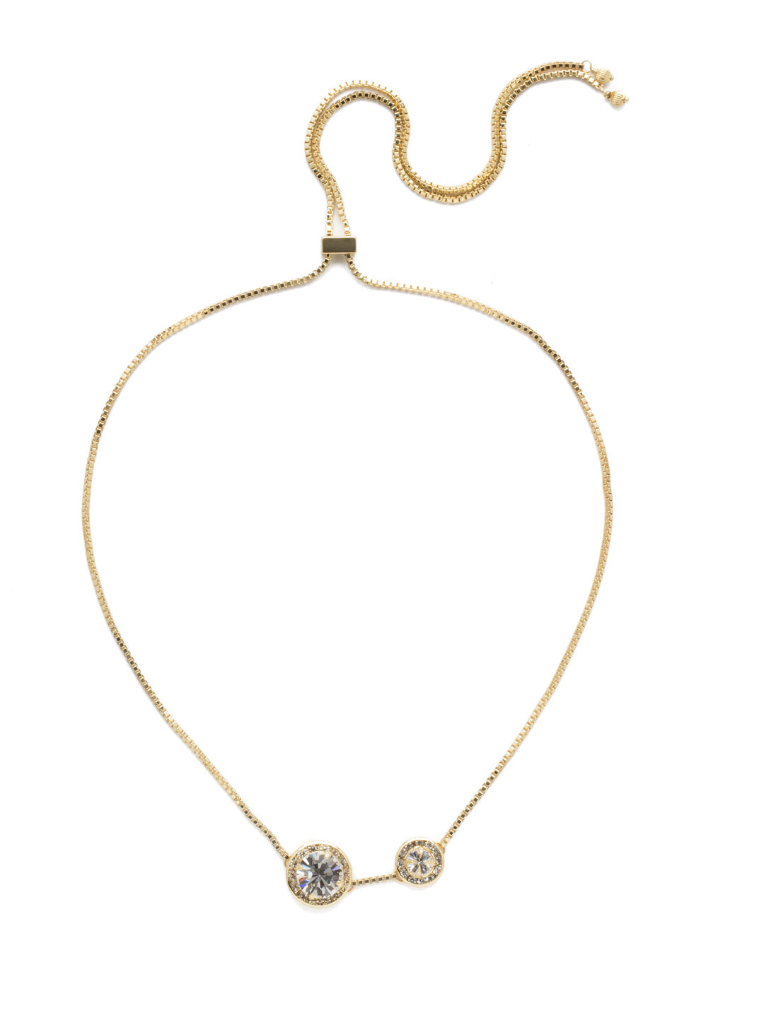 Dua Adjustable Pendant Necklace - NEB25BGCRY - <p>Two brilliant crystals bordered by smaller round crystals make up this simplistic yet glamorous choker, which can be adjusted to fit all sizes. Layer this necklace with others of varying lengths and shapes. From Sorrelli's Crystal collection in our Bright Gold-tone finish.</p>