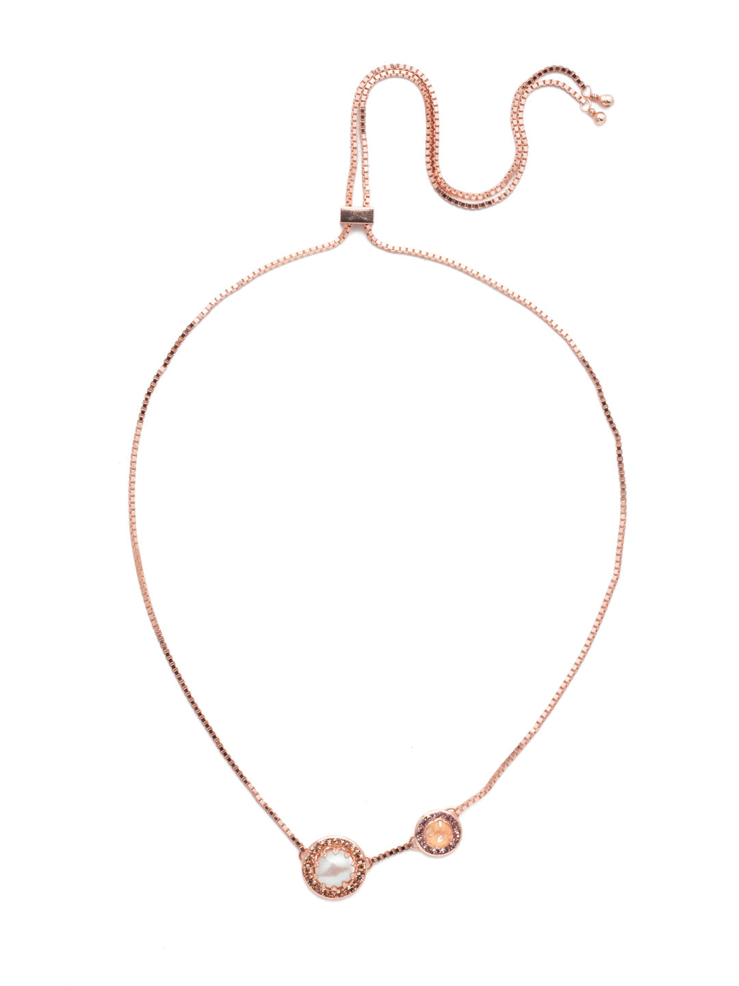 Dua Adjustable Pendant Necklace - NEB25RGLVP - <p>Two brilliant crystals bordered by smaller round crystals make up this simplistic yet glamorous choker, which can be adjusted to fit all sizes. Layer this necklace with others of varying lengths and shapes. From Sorrelli's Lavender Peach collection in our Rose Gold-tone finish.</p>