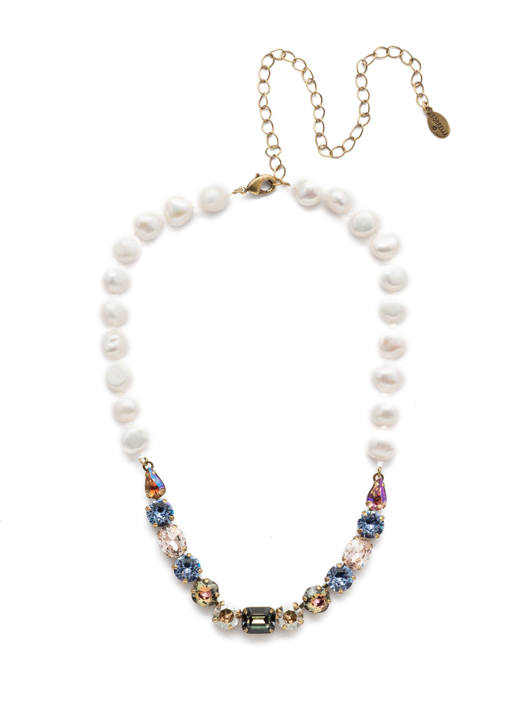 Cadenza Tennis Necklace - NEC14AGSDE - This classic beauty features a chain of wire-wrapped freshwater pearls supporting a delicate pattern of crystal shapes at its base. From Sorrelli's Selvedge Denim collection in our Antique Gold-tone finish.