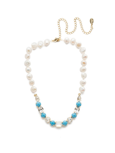 Cadenza Tennis Necklace - NEC14BGPLP - <p>This classic beauty features a chain of wire-wrapped freshwater pearls supporting a delicate pattern of crystal shapes at its base. From Sorrelli's Polished Pearl collection in our Bright Gold-tone finish.</p>