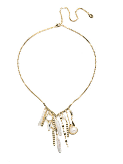 Fiorella Bib Necklace - NEC1BGPLP - <p>A unique and eye-catching combo of pearls and detailed metal pieces hang down from a V-shaped central piece. Customize your desired length with an adjustable lobster claw closure. From Sorrelli's Polished Pearl collection in our Bright Gold-tone finish.</p>