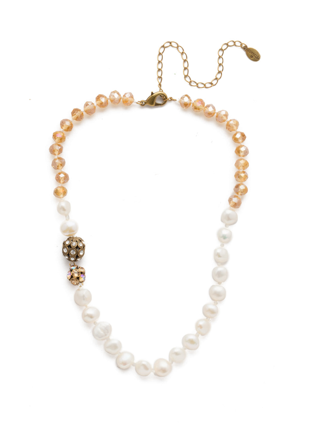 Cailey Tennis Necklace - NEF20AGROB - A classic necklace with an intricate pattern of pearls interrupted by two sparkling spheres. This is the perfect amount of sparkle that adds a little something extra to your evening out. From Sorrelli's Rocky Beach collection in our Antique Gold-tone finish.