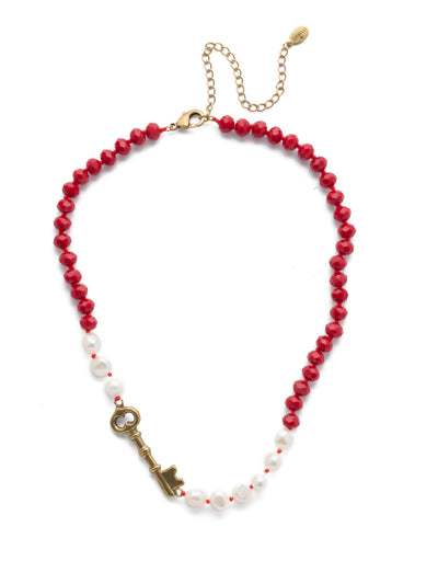 Eilidh Classic Necklace - NEF8AGSNR - <p>A detailed beaded and pearl texture is highlighted with its polished shine. This necklace is decorated with a single key charm to help get your look locked down for the day. From Sorrelli's Sansa Red collection in our Antique Gold-tone finish.</p>