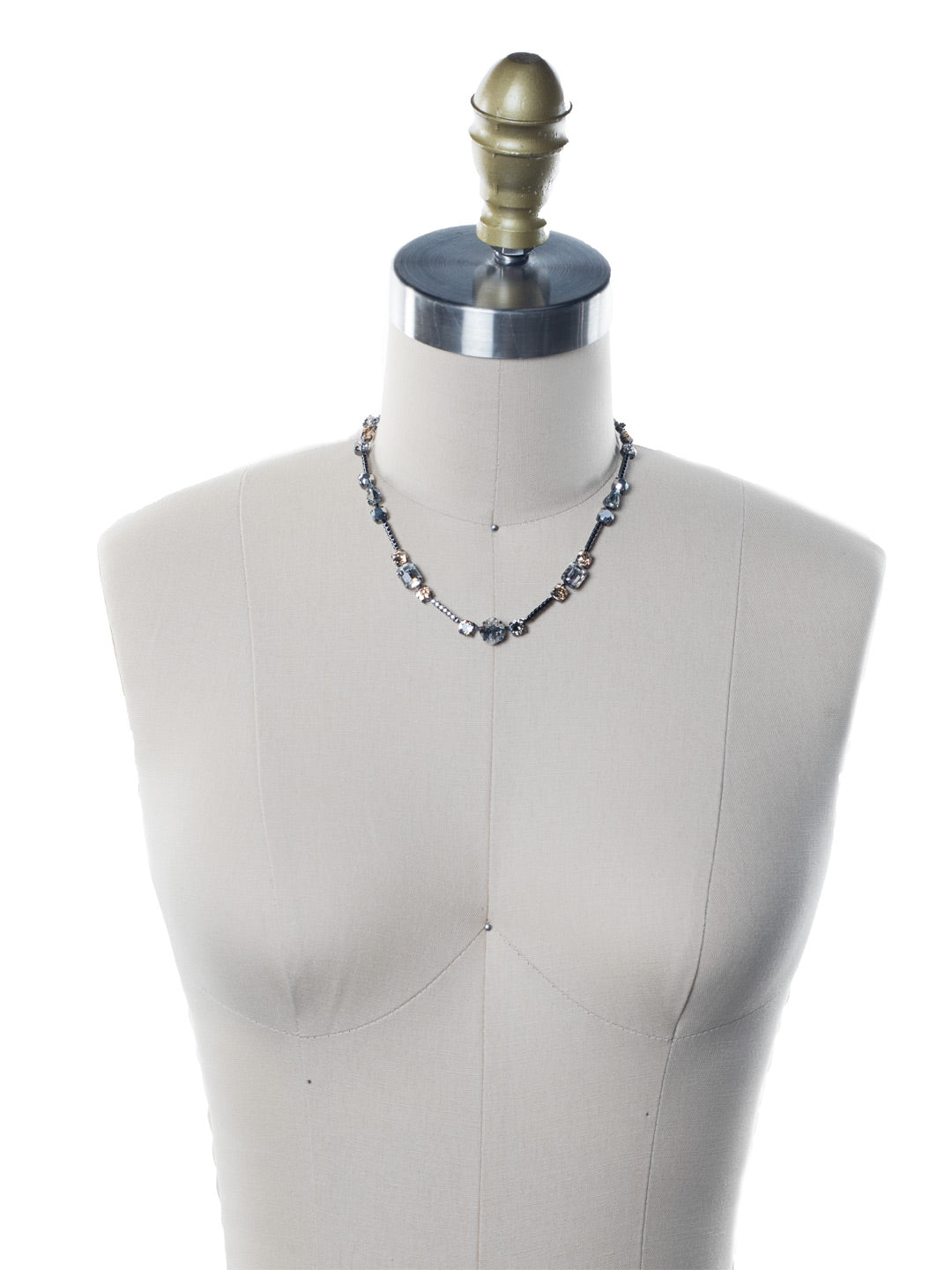 Poppy Tennis Necklace - NEN18GMGNS - The Poppy Tennis Necklace is anything but ordinary. Wear it all when you combine classic, baguette and navette sparklers. It's structured and sophisticated. From Sorrelli's Golden Shadow collection in our Gun Metal finish.